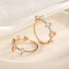 image:imageEVEVIC Austrian Crystal Half Hoop Earrings for Women14K Rose Gold Plated  Austrian crystal sculpted halfhoop silhouette 14K rose gold plated brass sparkling CZ accents pushback postsPink Opal Main Crystal
