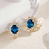 image:imageOval Austrian Crystal Halo Clip On Earrings for Women  Oval Austrian Crystal with Zircon Halo14K GoldPlatedSilicone Comfort PadGift Box IncludedFor Daily and Evening EventsDark Blue