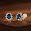 image:imageOval Austrian Crystal Halo Clip On Earrings for Women  Oval Austrian Crystal with Zircon Halo14K GoldPlatedSilicone Comfort PadGift Box IncludedFor Daily and Evening EventsDark Blue